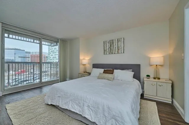 a bathroom with a sink vanity mirror and toilet
