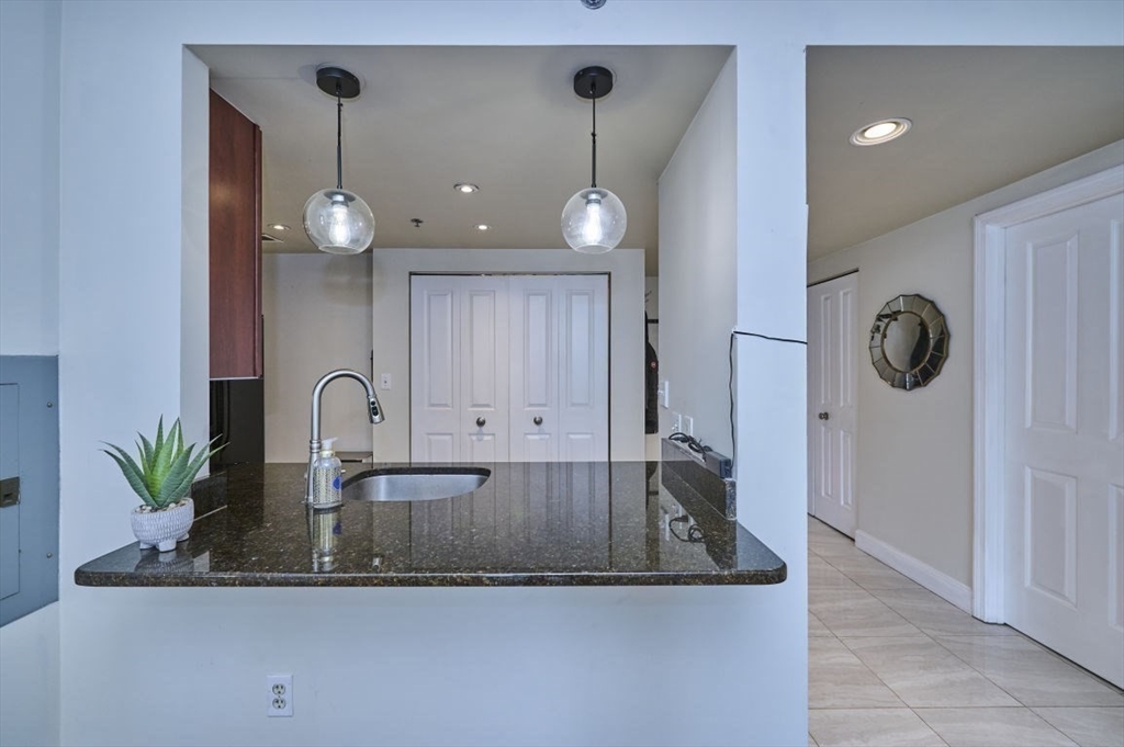 10 Museum Way, Unit 525 Cambridge, MA 02141 - Photo 5 of 22 an view of a kitchen counter space a sink and cabinets