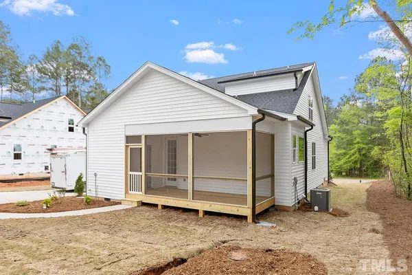 a view of a house with a yard and garage
