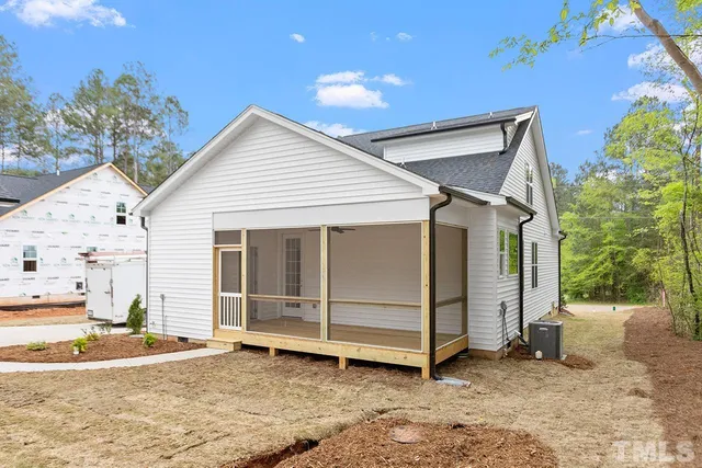 a view of a house with a yard and garage