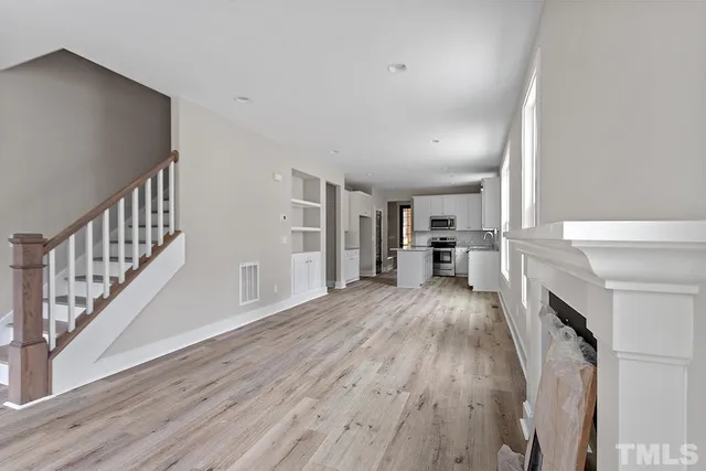 a view of livingroom with hardwood floor and a ceiling fan