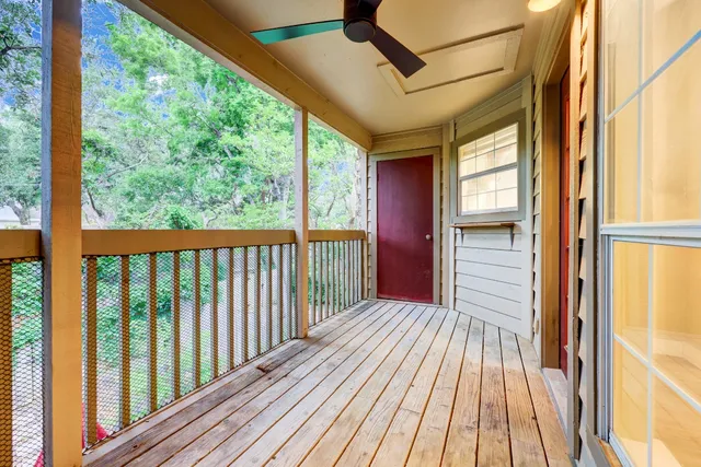 a view of balcony with wooden floor