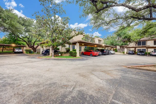 a view of street with parked cars