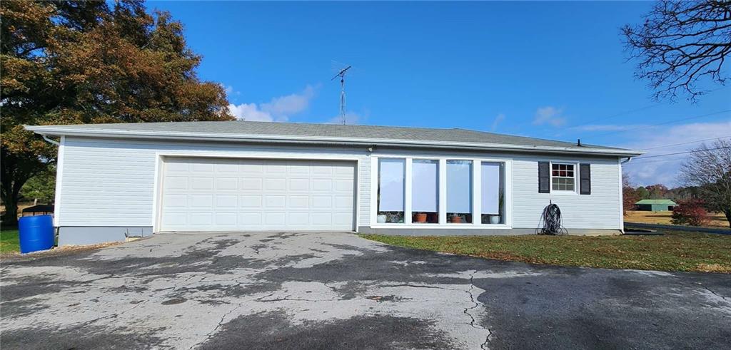 246 Defoor Road Resaca, GA 30735 - Photo 11 of 35 a front view of a house with a yard