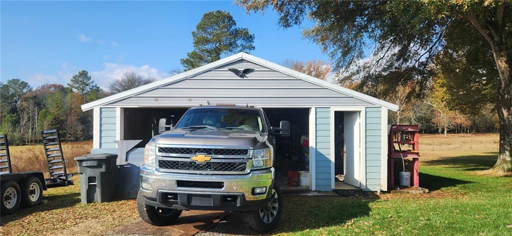 246 Defoor Road Resaca, GA 30735 - Photo 15 of 35 a front view of a house with yard