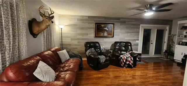 a bedroom with furniture and a window