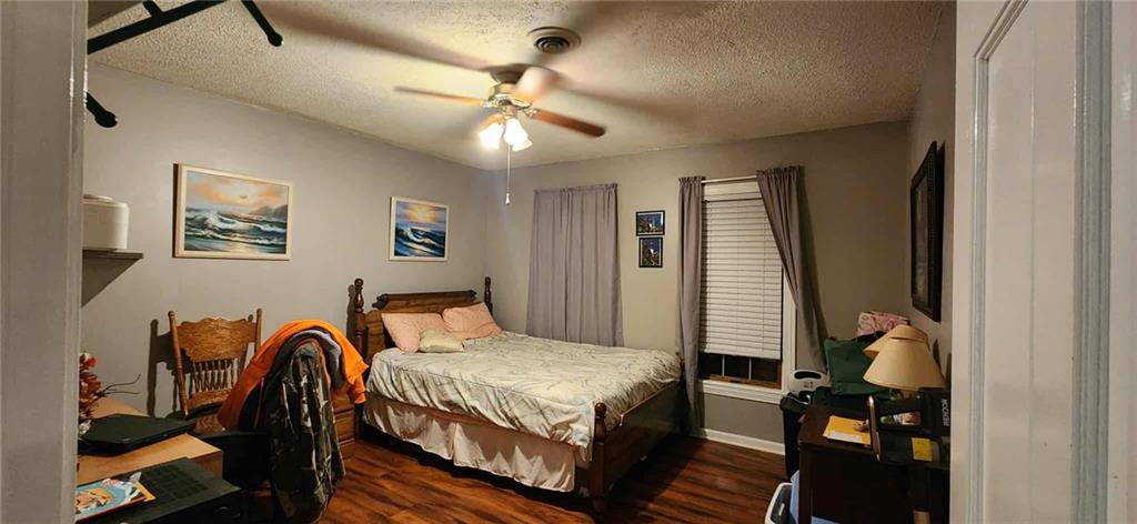 246 Defoor Road Resaca, GA 30735 - Photo 35 of 35 a bedroom with a bed and wooden floor