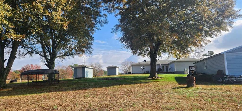 246 Defoor Road Resaca, GA 30735 - Photo 8 of 35 a view of a house with backyard and tree