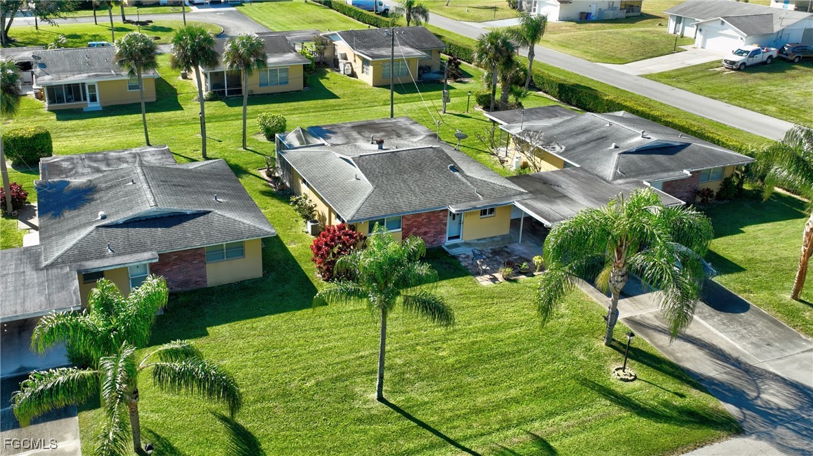 2212 East 6th Street Lehigh Acres, FL 33936 - Photo 2 of 34 an aerial view of a house with a garden