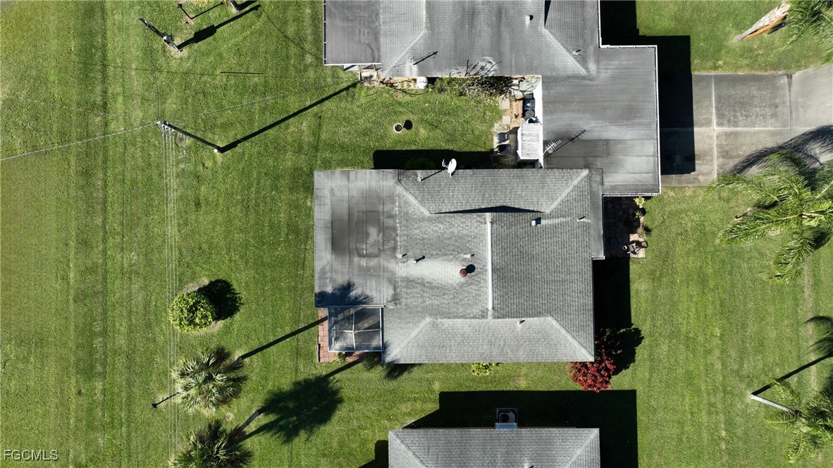 2212 East 6th Street Lehigh Acres, FL 33936 - Photo 4 of 34 an aerial view of a house with a yard