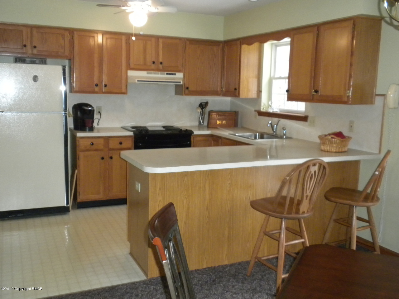 38 Hill Road Effort, PA 18330 - Photo 3 of 13 a kitchen with a sink a stove a refrigerator and cabinets