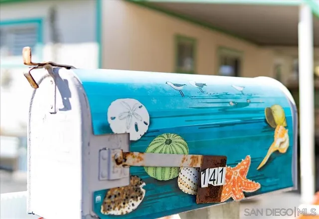 a room with stainless steel appliances kitchen island a stove and a wooden floors