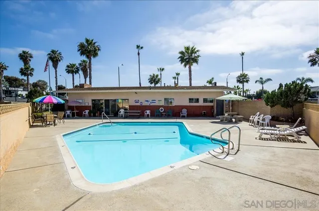 a view of a swimming pool with a patio
