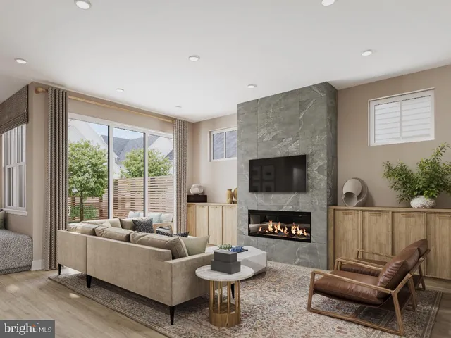 a living room with furniture and a book shelf