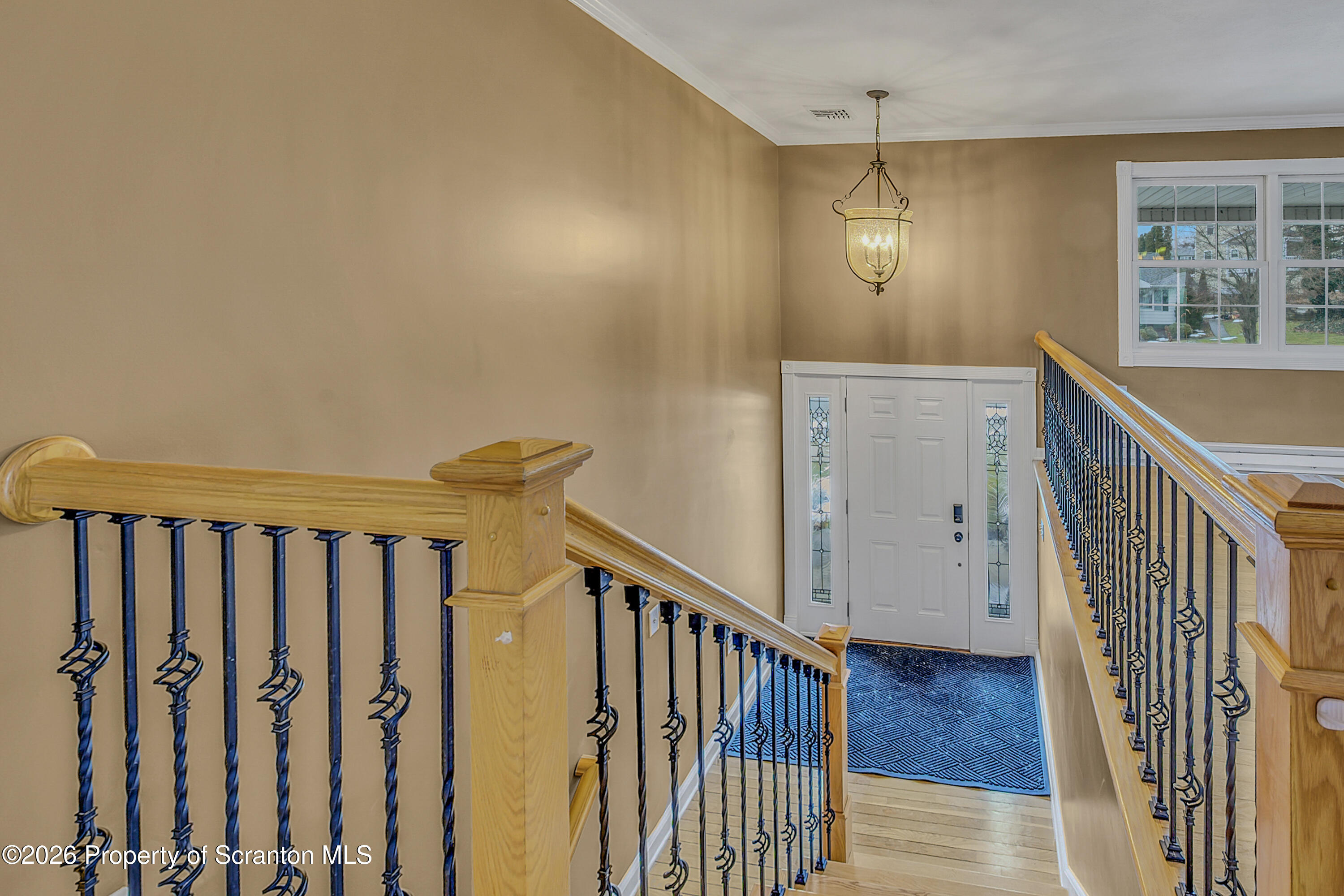 804 School Street Moosic, PA 18507 - Photo 13 of 67 a view of a hallway with wooden floor and staircase