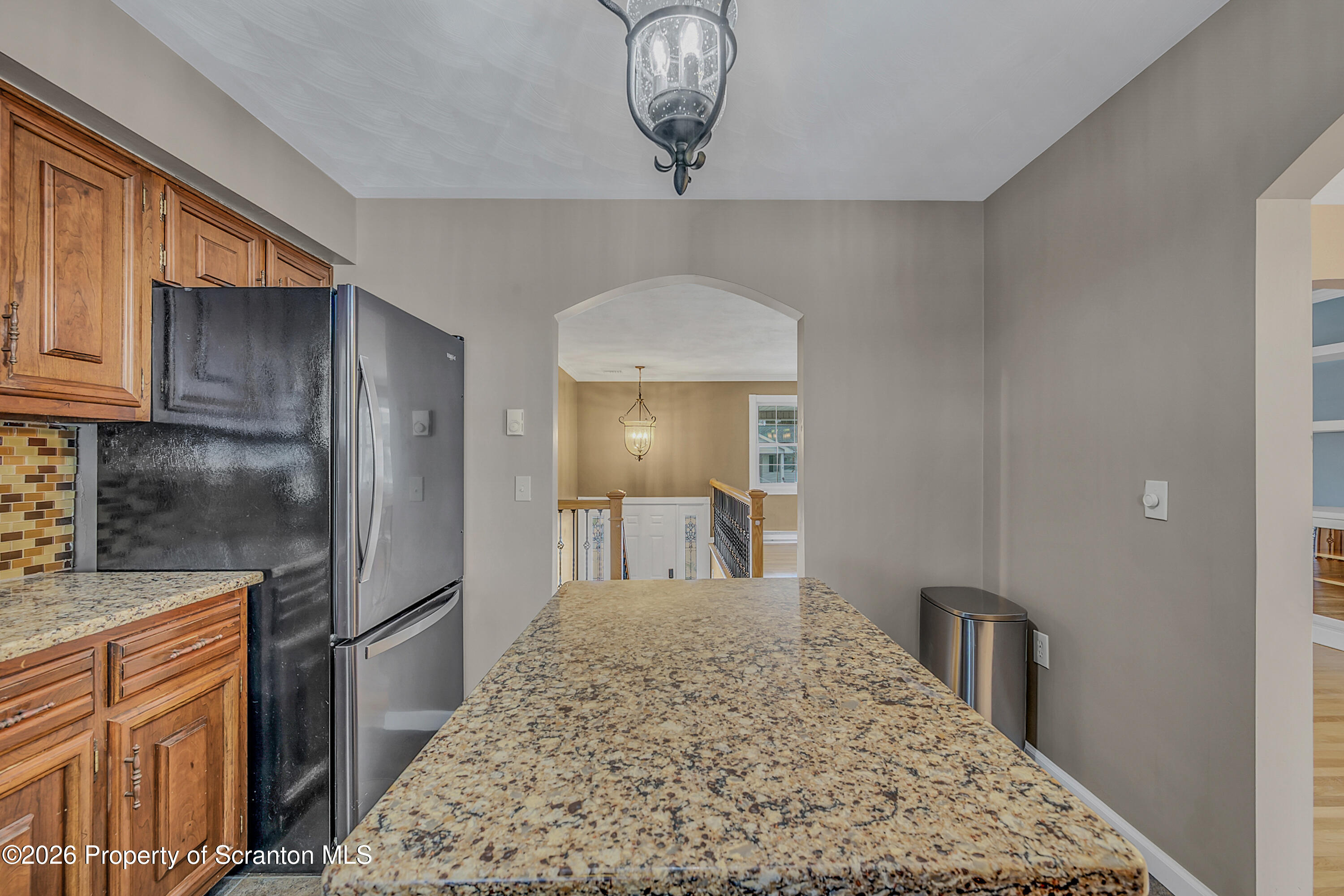 804 School Street Moosic, PA 18507 - Photo 16 of 67 a kitchen with stainless steel appliances granite countertop a refrigerator sink and cabinets
