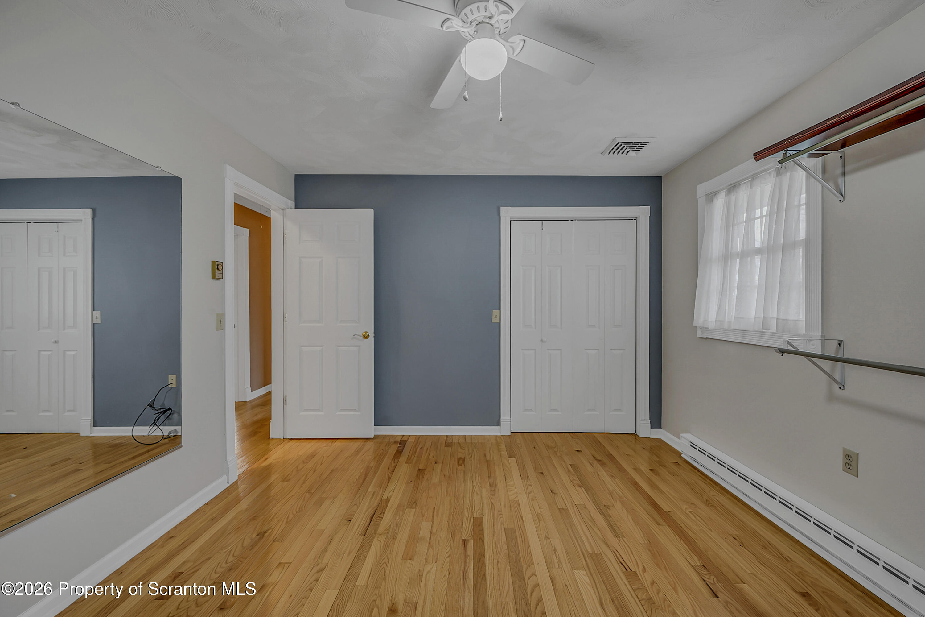 804 School Street Moosic, PA 18507 - Photo 23 of 67 a view of empty room with wooden floor and fan