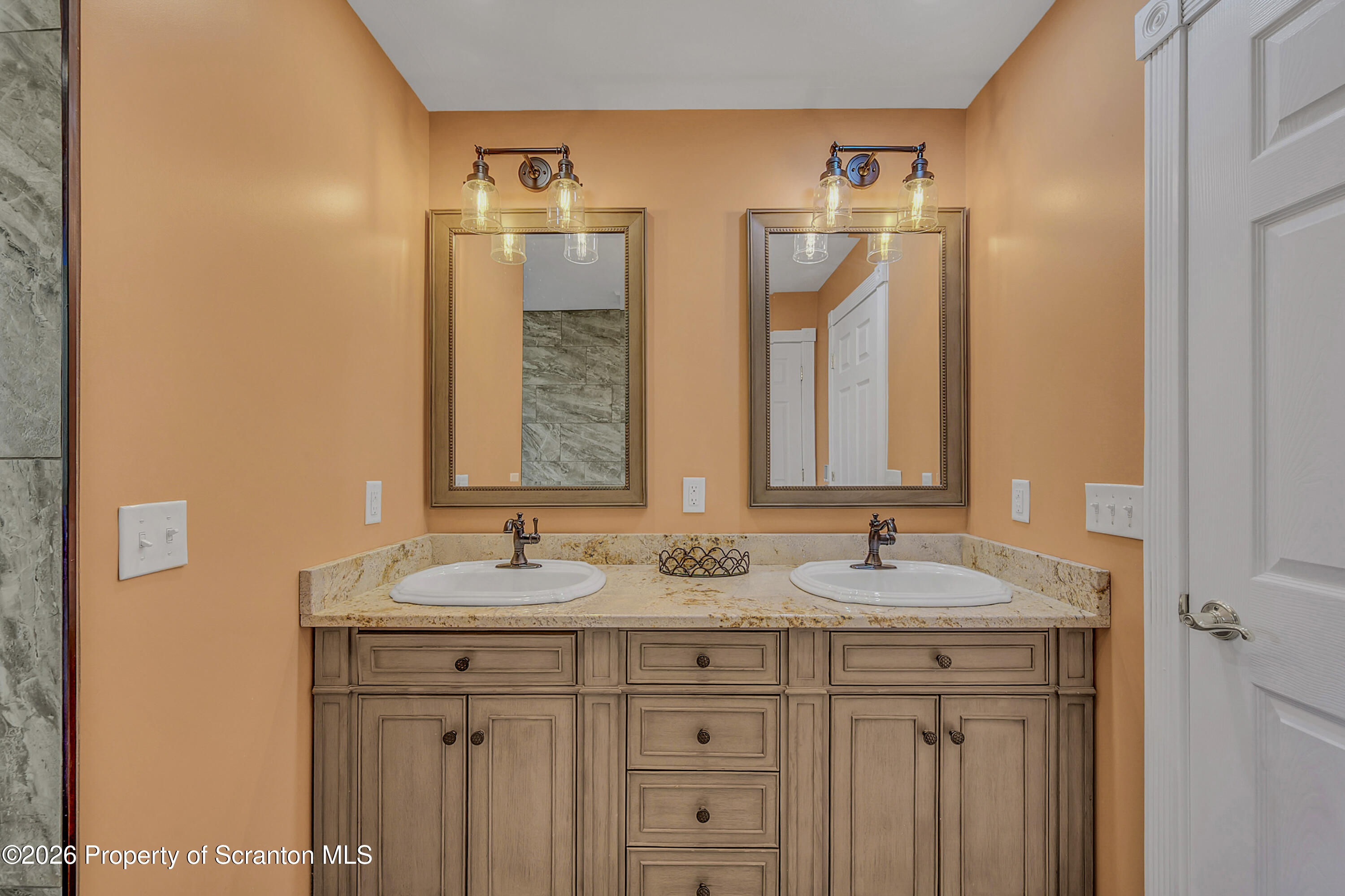 804 School Street Moosic, PA 18507 - Photo 33 of 67 a bathroom with a granite countertop sink and a mirror