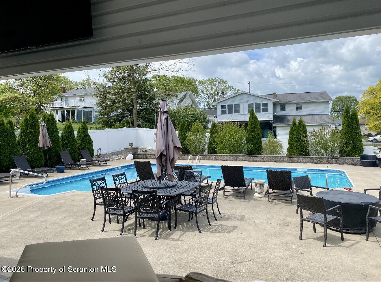 804 School Street Moosic, PA 18507 - Photo 59 of 67 a view of a patio with a dining table and chairs with wooden floor