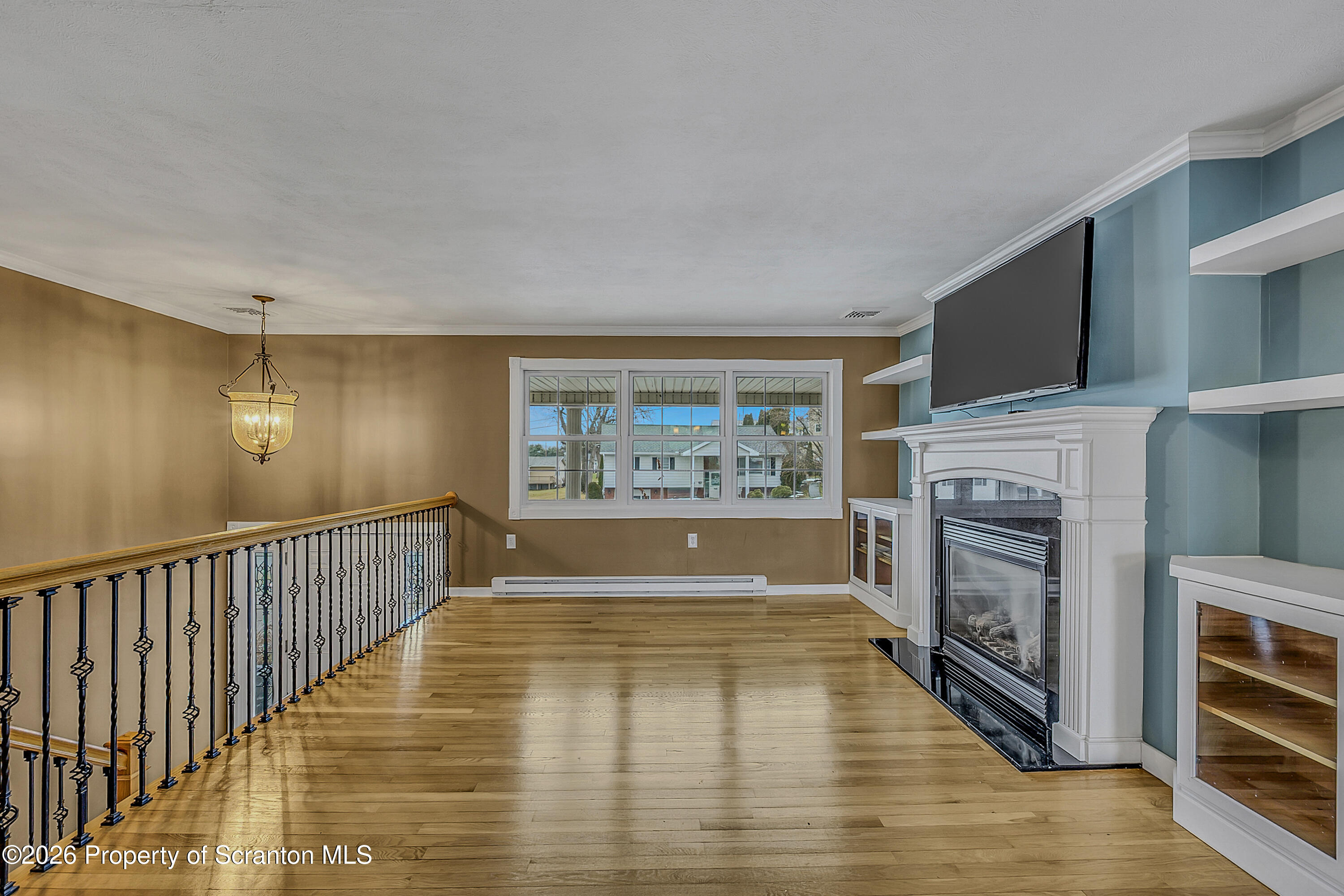 804 School Street Moosic, PA 18507 - Photo 9 of 67 a view of livingroom with hardwood floor and kitchen view