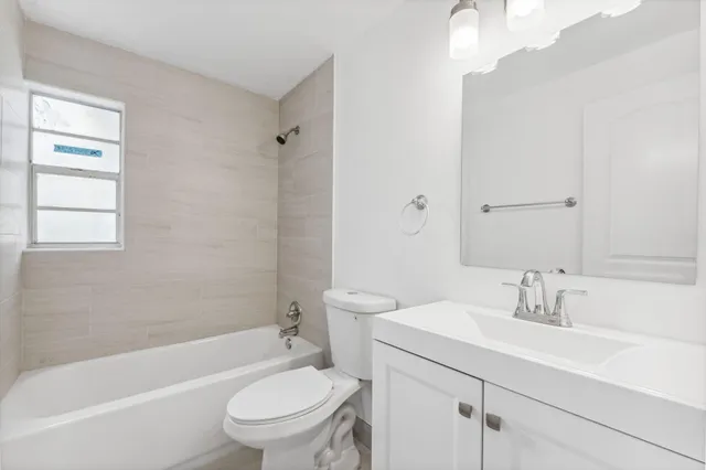 a bathroom with a sink toilet and a bathtub