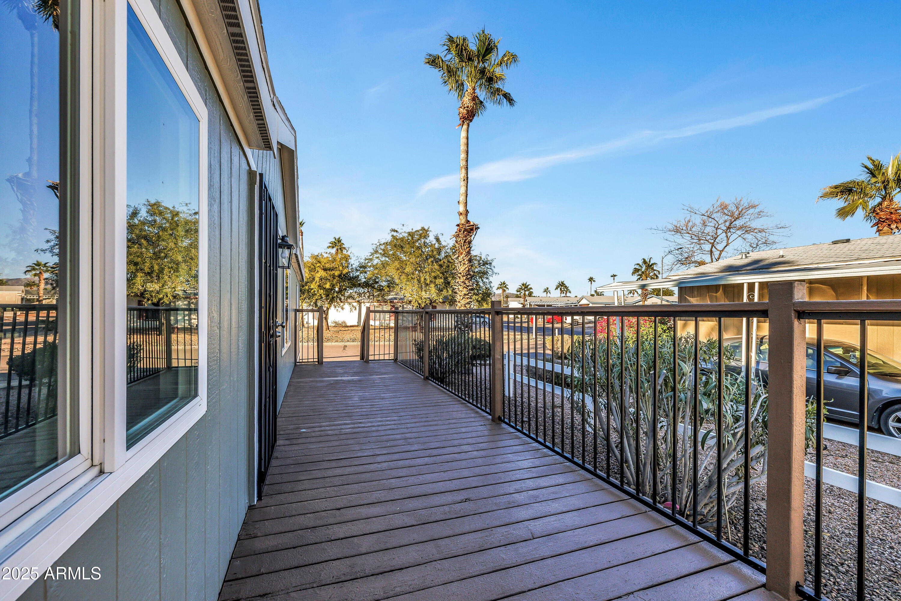 2000 South Apache Road, Unit 220 Buckeye, AZ 85326 - Photo 12 of 25 a view of a balcony with wooden floor