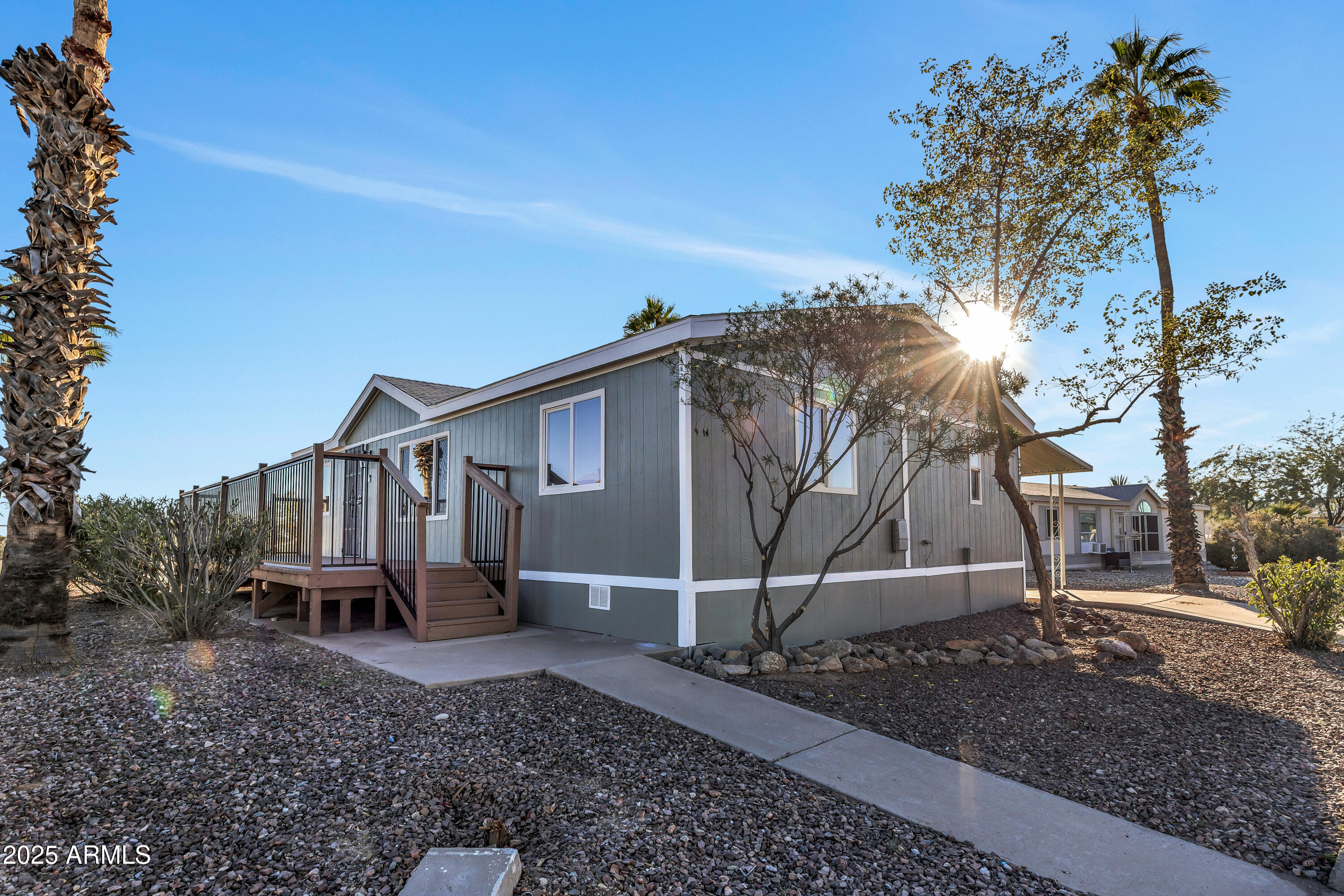 2000 South Apache Road, Unit 220 Buckeye, AZ 85326 - Photo 17 of 25 a backyard of a house with barbeque oven table and chairs