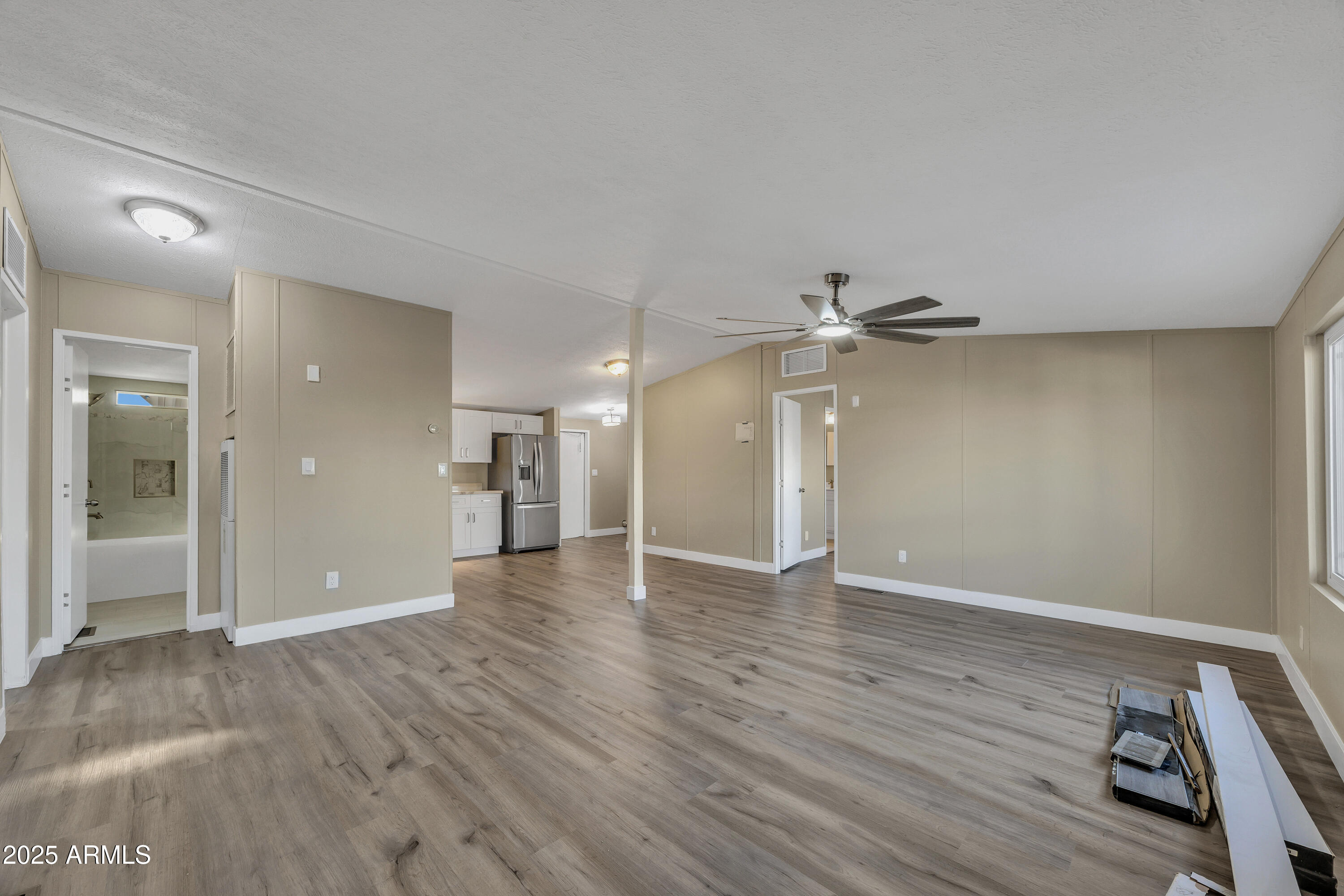 2000 South Apache Road, Unit 220 Buckeye, AZ 85326 - Photo 19 of 25 wooden floor in an empty room with a window