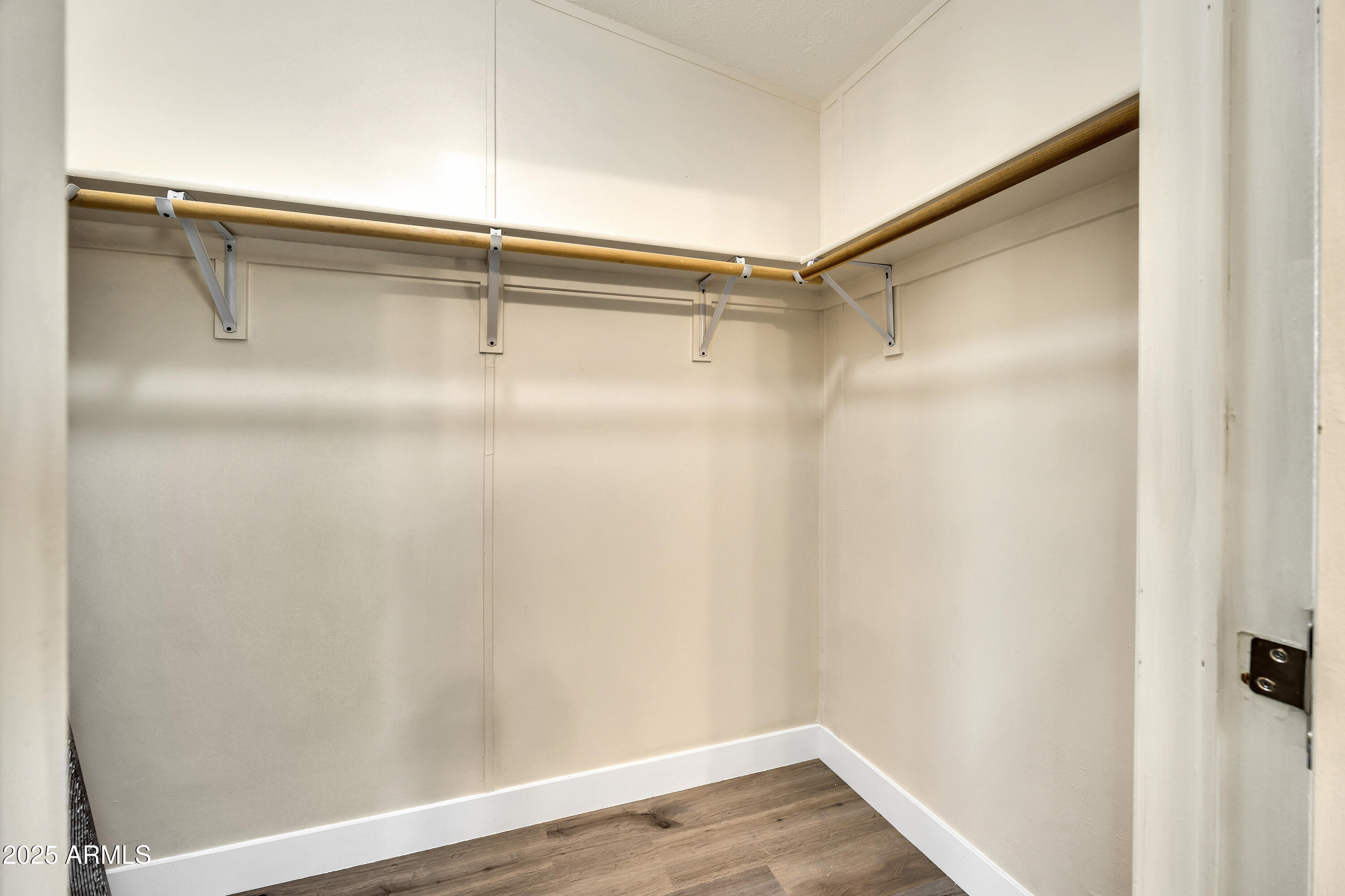 2000 South Apache Road, Unit 220 Buckeye, AZ 85326 - Photo 5 of 25 a view of a room with racks on the wall