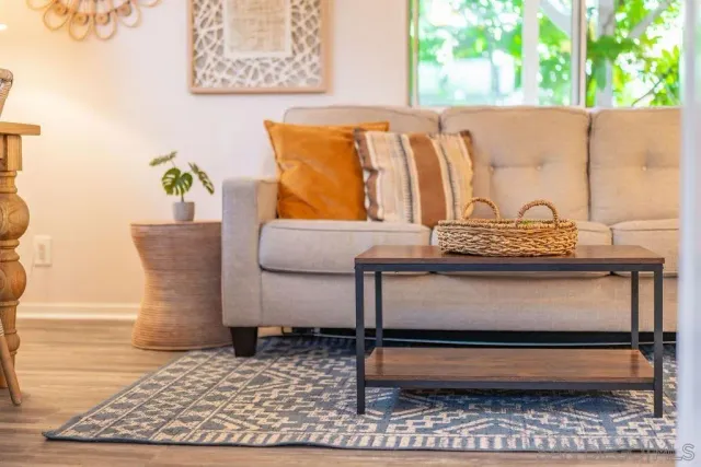 a white bench sitting in a kitchen next to a window