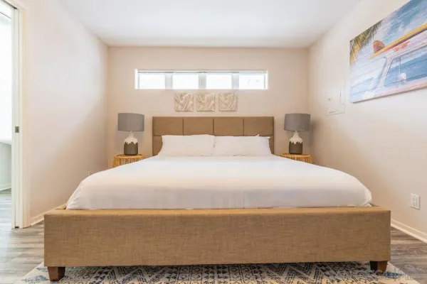 a bedroom with a bed and window