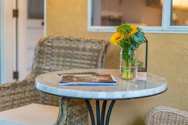 a vase of flowers sitting on a table