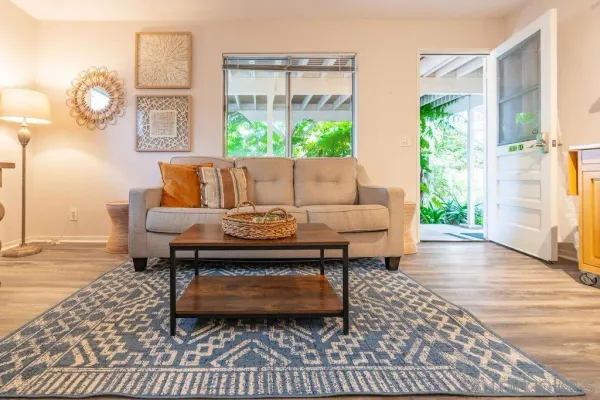 a living room with furniture and a table