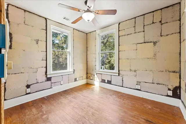 a spacious bathroom with a bathtub and a shower