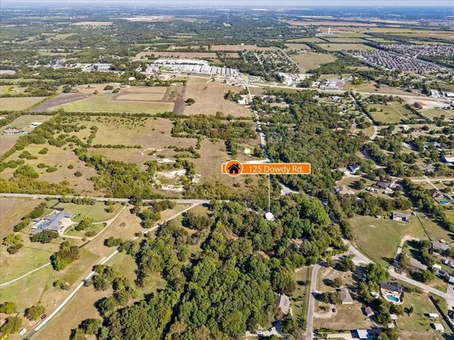 an aerial view of residential building with parking space