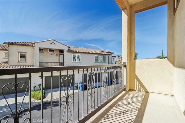 a view of a balcony with chairs