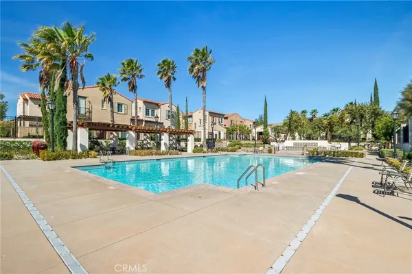 a view of a swimming pool with a table and chairs