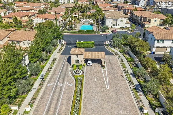 an aerial view of a house with swimming pool outdoor seating and yard