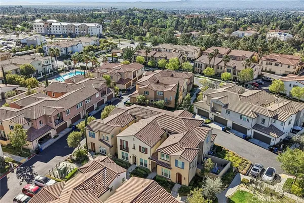 an aerial view of a city with lots of residential buildings