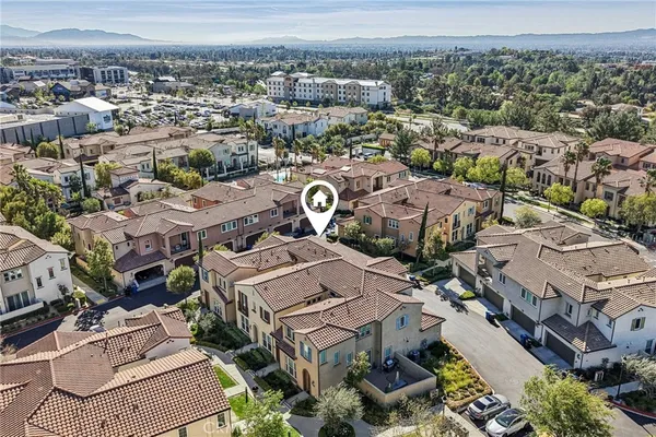 an aerial view of a house with a city view