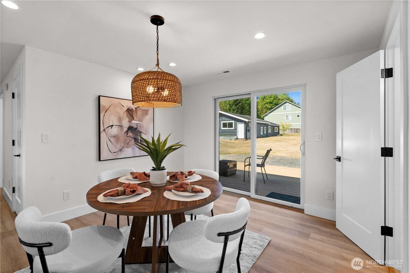 12208 Southeast 192nd Street Renton, WA 98058 - Photo 14 of 40 a view of a dining room with furniture window and wooden floor