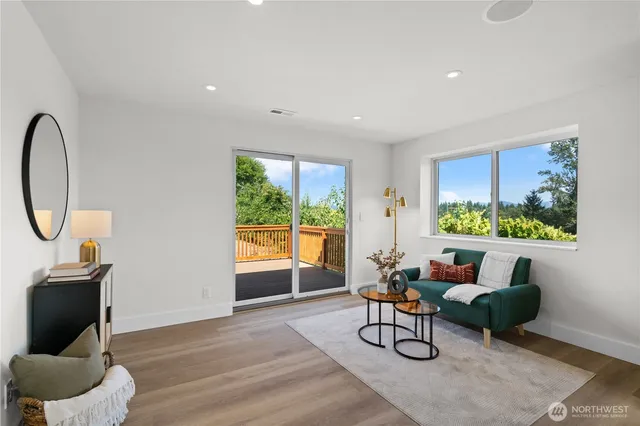 a bed room with a bed and table chair