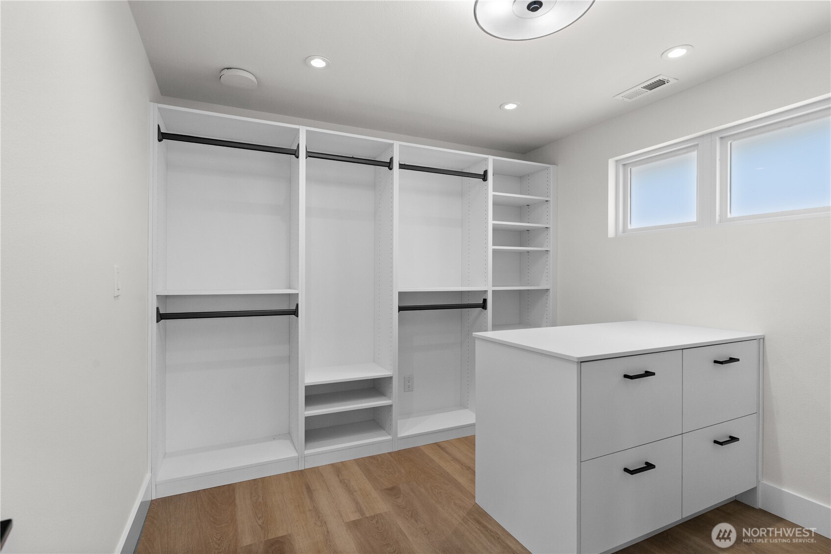 12208 Southeast 192nd Street Renton, WA 98058 - Photo 21 of 40 a view of walk in closet with wooden floor