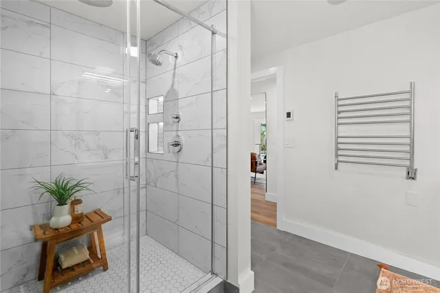 a bathroom with a double vanity sink toilet mirror and window