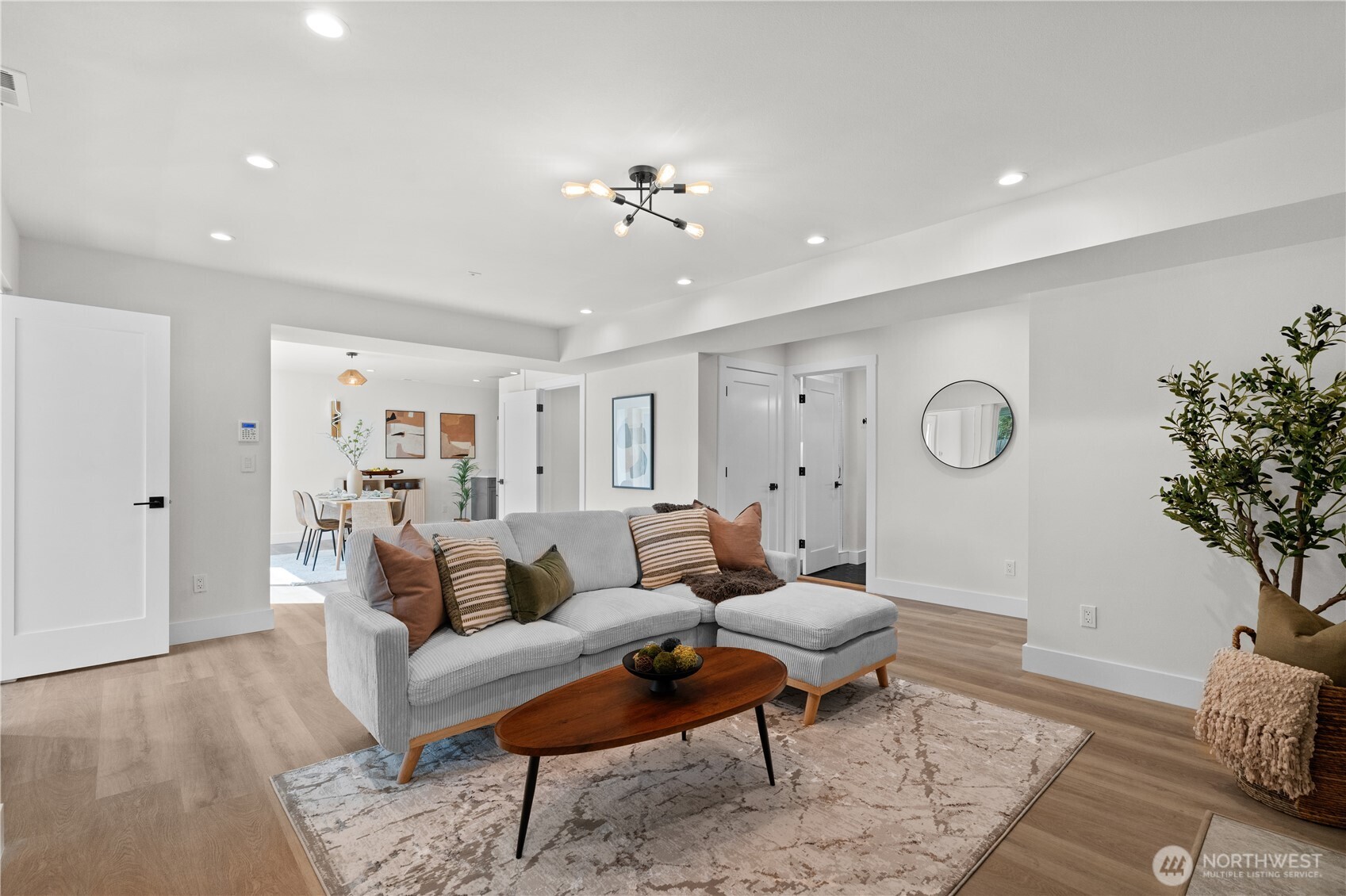 12208 Southeast 192nd Street Renton, WA 98058 - Photo 26 of 40 a living room with furniture a rug and a potted plant
