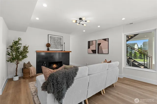 a kitchen with granite countertop a refrigerator and a stove top oven