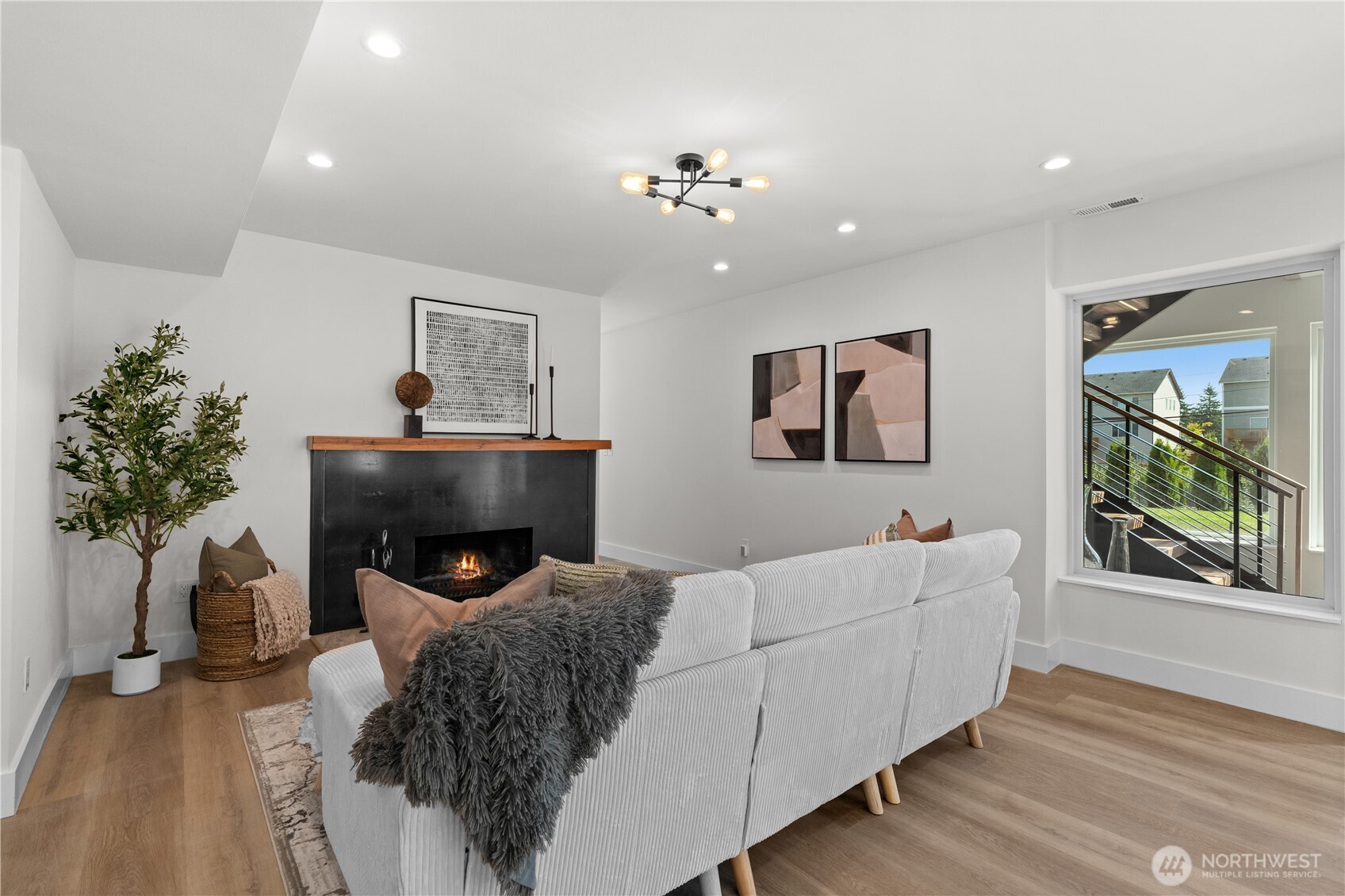 12208 Southeast 192nd Street Renton, WA 98058 - Photo 28 of 40 a living room with furniture and a fireplace