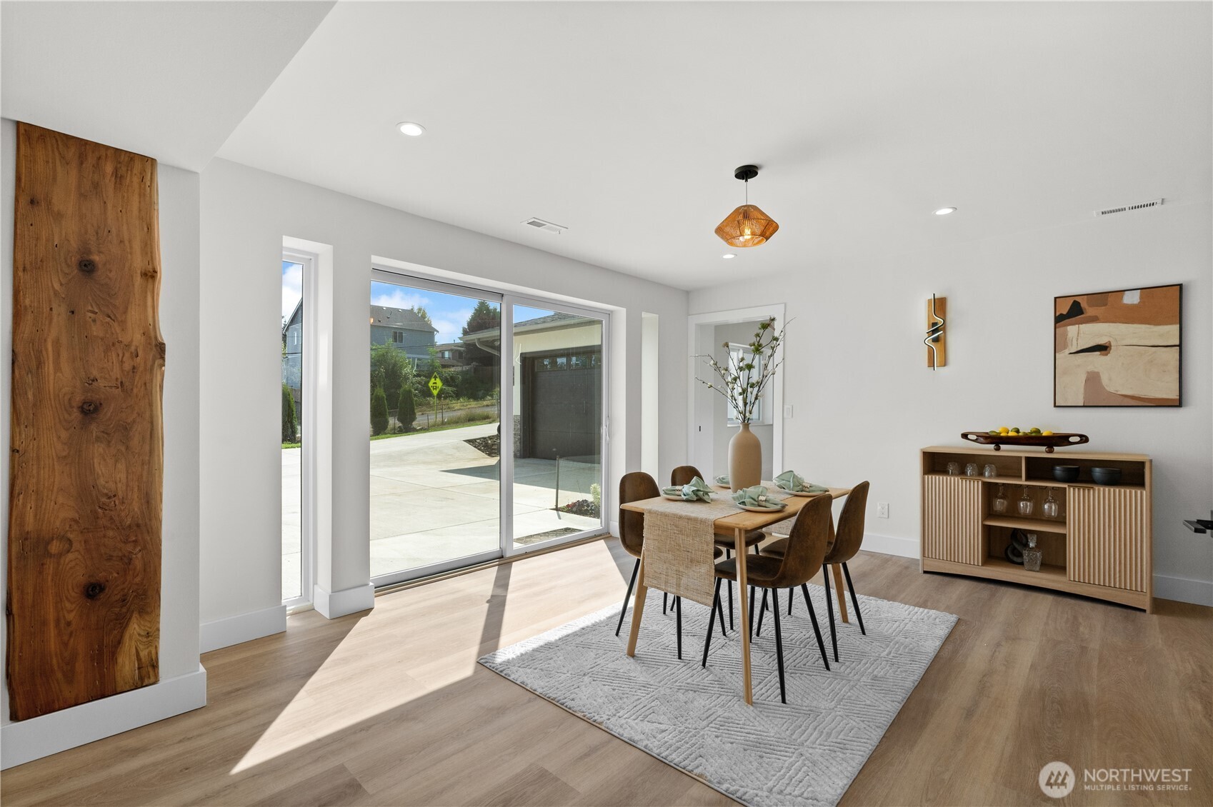 12208 Southeast 192nd Street Renton, WA 98058 - Photo 32 of 40 a view of a dining room with furniture and chandelier