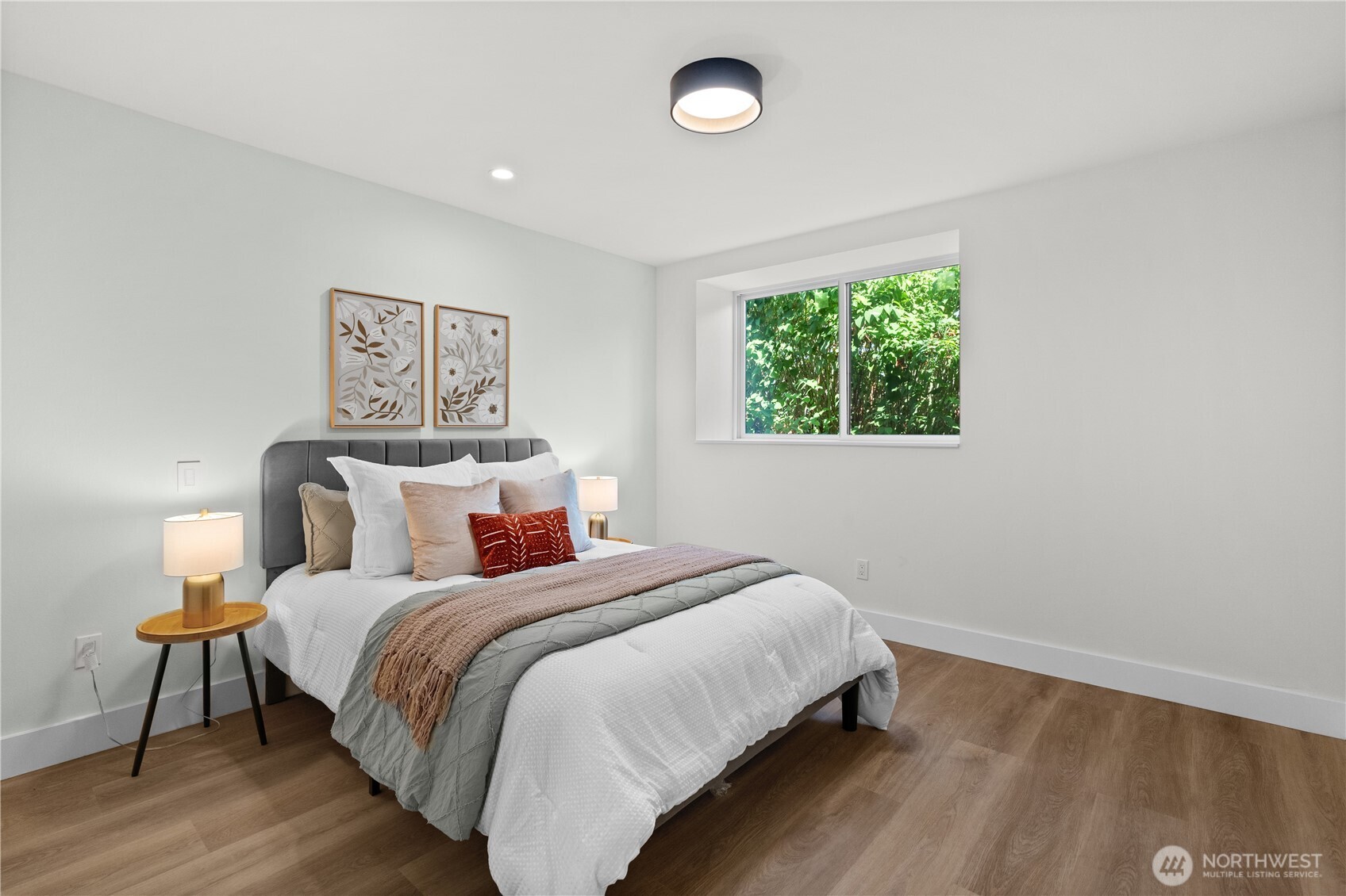 12208 Southeast 192nd Street Renton, WA 98058 - Photo 33 of 40 a bedroom with a bed and a lamp