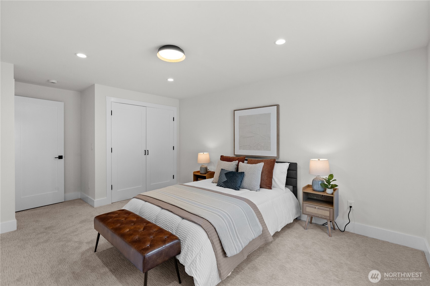 12208 Southeast 192nd Street Renton, WA 98058 - Photo 34 of 40 a bedroom with a bed and a lamp